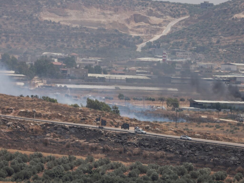 Two Palestinians shot dead by Israeli forces as West Bank fields set ablaze