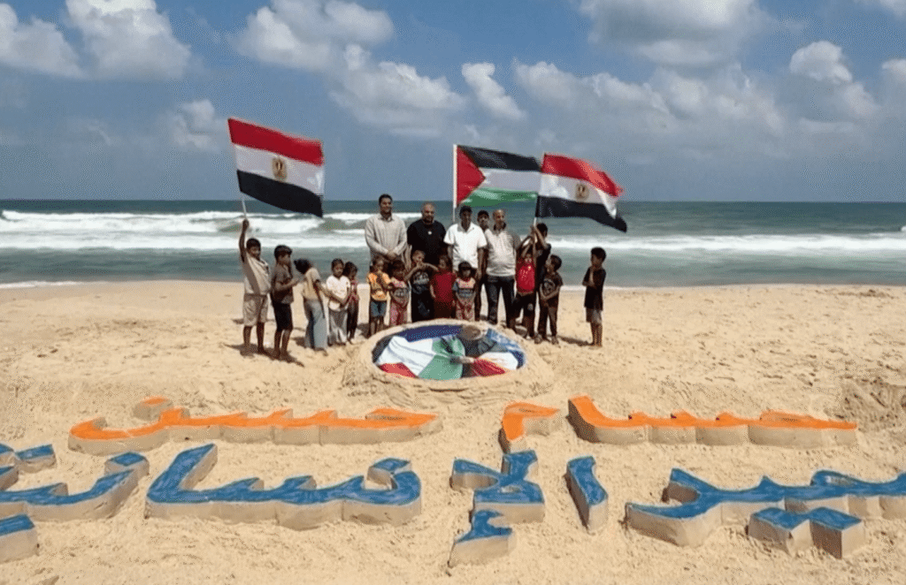 Gaza artists honour Egypt coach Hossam Hassan with sand portrait