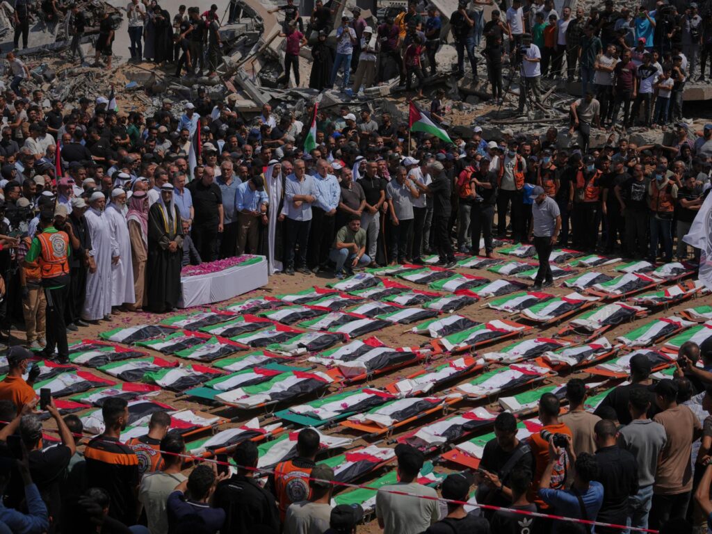 Photos: Thousands in Gaza City join mass funeral for 112 Palestinians